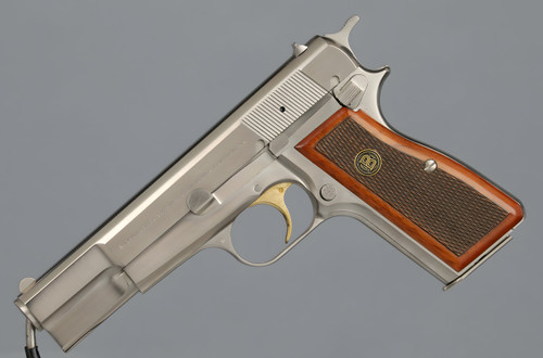 Belgian Browning High-Power pistol with stainless finish and walnut grip.