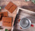 Brown Logo - Watson Square PU Leather Coaster: 4 piece Set in Holder