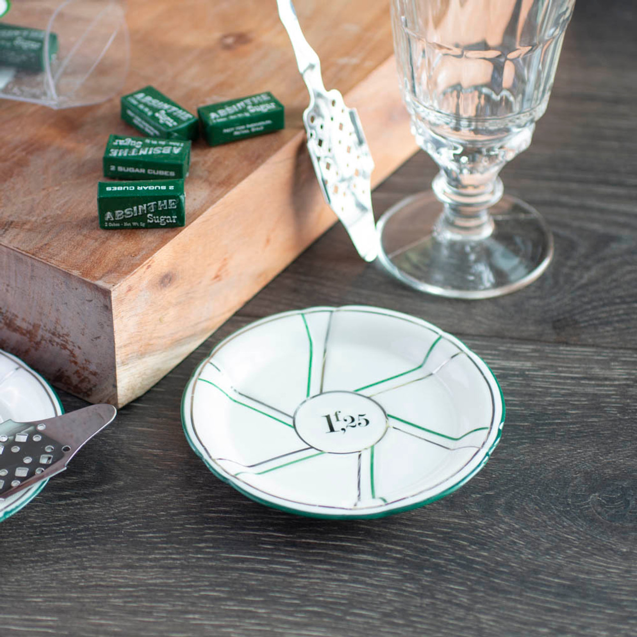 https://cdn11.bigcommerce.com/s-cznxq08r7/images/stencil/1280x1280/products/2510/570/1712-porcelain-absinthe-saucer-green-and-silver-pinwheel-accents-with-french-francs-design-3__65276.1590763686.jpg?c=1