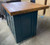 Kitchen island with solid cupboard base and reclaimed top