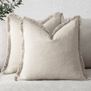 Set of 2 beige linen fringe tassel throw pillow covers 20x20 inches with boho farmhouse style on a sofa