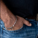 Man wearing the Fishers of Men stainless steel bracelet engraved with Matthew 4:19.