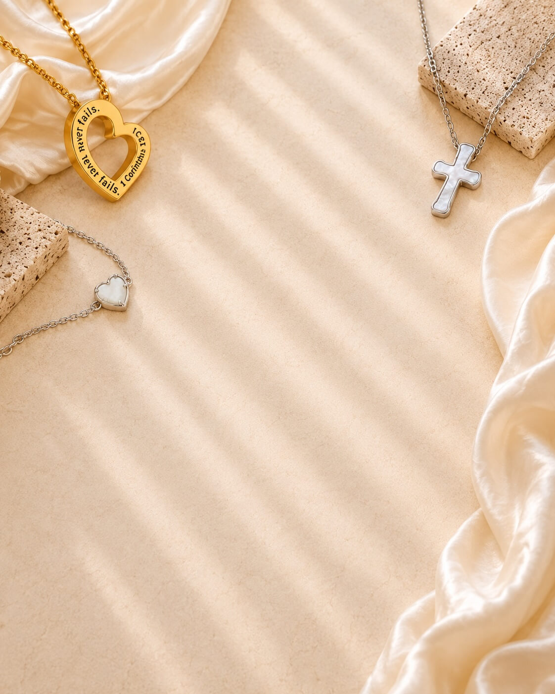 1 Corinthians 13 'Love Never Fails' heart necklace, cross necklace, and bracelet in gold and silver by Shields of Strength