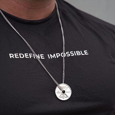 Athlete wearing fitness cross necklace from Shields of Strength