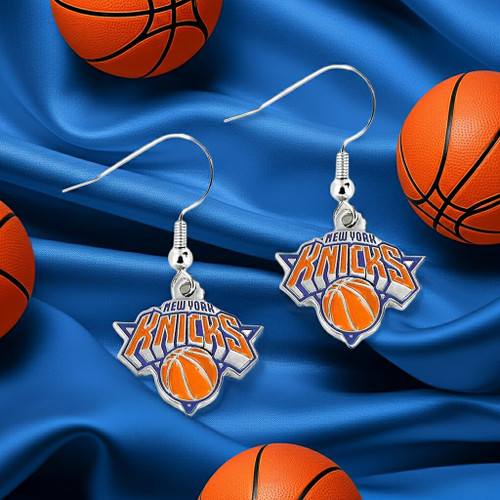 New York Knicks Basketball Orange & Blue Dangle Logo Earrings - Displayed on a blue fabric basketball themed background