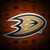Anaheim Ducks NHL Team Logo Magnet - Displayed on a hockey themed gradient orange color background