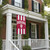 Indiana Hoosiers NCAA 28" x 40" Banner Flag - Team Wordmark & Logo - Outdoors - Hanging on a porch