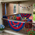 New England Patriots NFL Logo Bunting Banner Flag – 51" × 27" – Ruffled Team‑Color Panels with Embroidered Patriots Logo - Displayed outdoors hanging on the railing of a deck.