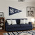 New York Yankees 3 ft x 5 ft Pennant Flag - Displayed indoors hanging on a wall in a baseball themed room
