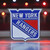 New York Rangers NHL Color Metal  Logo Emblem - Displayed on a hockey rink background