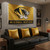 Mizzou Nation NCAA 3' x 5' Flag – Gold & Black Collegiate Banner with Official Tiger Logo - Displayed indoors hanging on a wall in a sports themed room.
