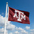 Texas A&M Aggies Large Logo Flag - Outdoors - Displayed flying from a flag pole