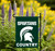 Michigan State University NCAA Spartans Country Flag - Displayed on a garden flag stand outdoors