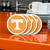 Tennessee Volunteers Logo Coasters - On an Orange Kitchen Island - Close Up Tennessee Volunteers Logo Coasters - On an Orange Kitchen Island - Close Up