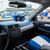Kentucky Wildcats Blue & White Plush Fuzzy Logo Dice - Hanging from a vehicles rear view mirror at a sporting event.