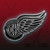 Detroit Red Wings Hockey Silver & Black Chrome Logo Emblem - Displayed on a hockey themed background