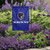 Baltimore Ravens NFL Purple 11" x 15" Mascot Logo Wordmark Garden Flag - On a garden flag pole - in a garden