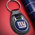 New York Giants NFL Black Leather Key Fob Keychain - Displaying NY Logo - On a red table next to a blue color Giants wallet