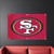 San Francisco 49ers Logo Banner Flag - Displayed indoors hanging above a couch