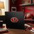 Atlanta Falcons Color Chrome Logo Emblem - Displayed in a football themed room on the back of a black laptop