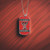 Texas Tech University NCAA Color Dog Tag Necklace - on a Raiders red and black lined table