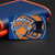 New York Knicks NBA Basketball Credit Card Logo Bottle Opener - Displayed on a black table next to a blue and orange wallet