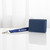 Tampa Bay Lightning NHL Blue & White Lanyard Clip Logo Key Chain - Displayed on a white table next to a blue wallet