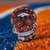 Denver Broncos Skull Logo Lapel Pin - Displayed on orange and blue Astro turf