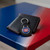 Montreal Canadiens Hockey Black Leather Keychain - Displayed on a blue and red table next to a black wallet