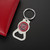 University Of South Carolina NCAA Bottle Opener Logo Keychain - Displayed on a black table next to a wallet
