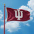 Indiana Hoosiers NCAA 3' x 5' (IU) Logo Flag - Flying on a Hoosiers Crimson Color Flag Pole, with the blue sky and clouds in the background