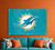 Miami Dolphins Football Wall Logo Flag - Indoors - Hanging on an Orange Wall, above an aqua couch, in a football fan cave
