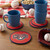 Washington Nationals MLB Red & Blue Coaster Set - Logo & Wordmark - Displayed on a table in a baseball themed setting