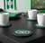 New York Jets Vinyl Coasters - 4 Piece Set - Displayed on a black table.