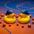 New York Knicks Basketball Rubber Duck Set - 2 Pack Logo Rubber Ducks - Displayed on a basketball court.