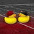 San Francisco 49ers Football Rubber Duck Set - 2 Pack Logo Rubber Ducks - Displayed on a red and black gradient football field