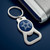 Dallas Cowboys Football Blue Bottle Opener Logo Keychain - Displayed on a blue table next to a silver wallet.