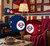 Philadelphia Phillies team logo fuzzy dice, with original die dots and connecting string, hang prominently in a detailed retro baseball-themed fan cave