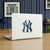 New York Yankees Aluminum Color Logo Emblem - Displayed on the back of a laptop