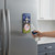 New York Yankees Magnetic Bottle Opener mounted on a refrigerator in a modern kitchen.