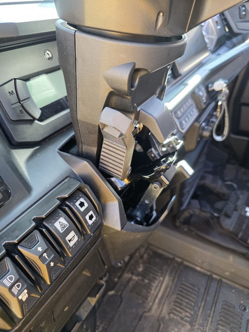 MarqCad carbon fiber reinforced steering adjustment handle installed on Can-Am Defender HD11 showing upgraded tilt lever durability