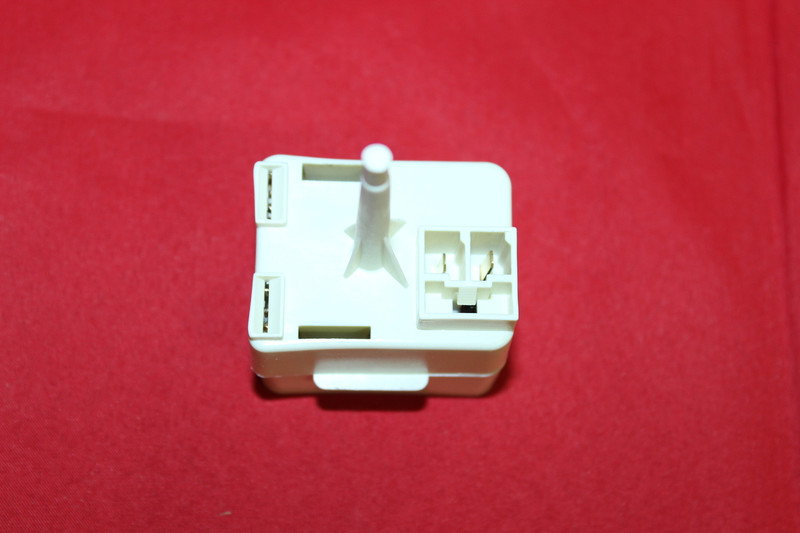 Replacement refrigerator start relay and overload 2188830 side view showing compressor terminals