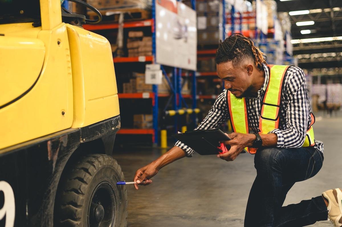 Warehouse Forklift Tire Selection Forklift operating on warehouse floor — choosing the right tire type for your floor surface reduces wear, downtime, and cost