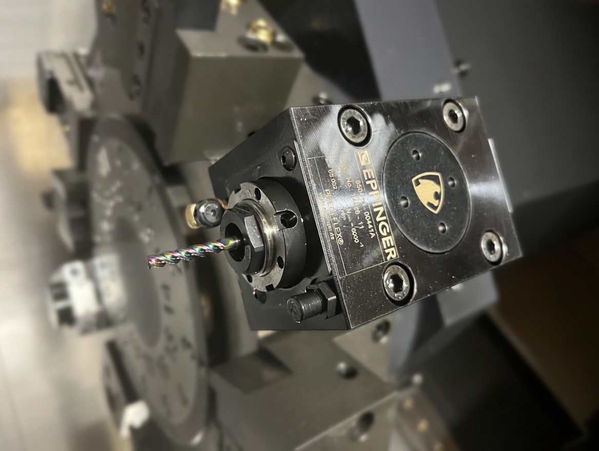 Live tooling holder with an endmill mounted in the lathe turret