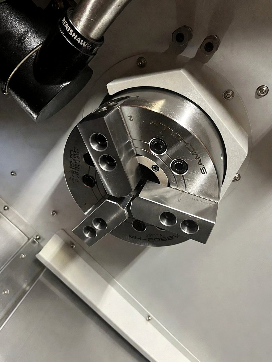 Samchully chuck with a Renishaw probe alongside
