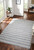 Antrim Las Palmas Ocean Wool Area Rug in sitting area