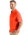 Side profile view of a man wearing a College Orange Cutter & Buck Coastline Epic Comfort Eco Recycled Mens Polo Thumbnail Image