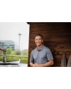 Man standing outdoors while wearing an Elemental Grey Cutter & Buck Prospect Eco Textured Stretch Recycled Mens Short Sleeve Polo Thumbnail Image