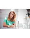 Woman at a restaurant wearing Fresh Mint Cutter & Buck Virtue Eco Pique Recycled Womens Polo Thumbnail Image