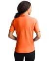 Back profile of a woman wearing an Orange Burst Cutter & Buck Virtue Eco Pique Recycled Womens Polo Thumbnail Image